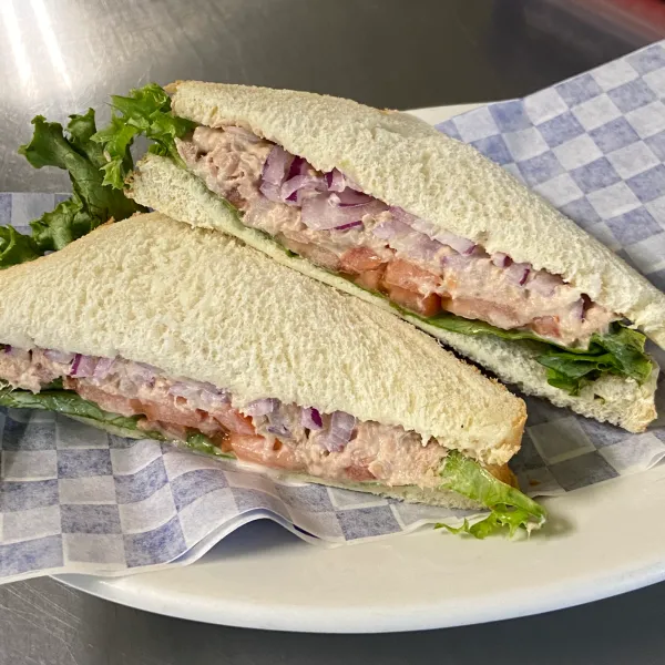 a sandwich cut in half on a plate